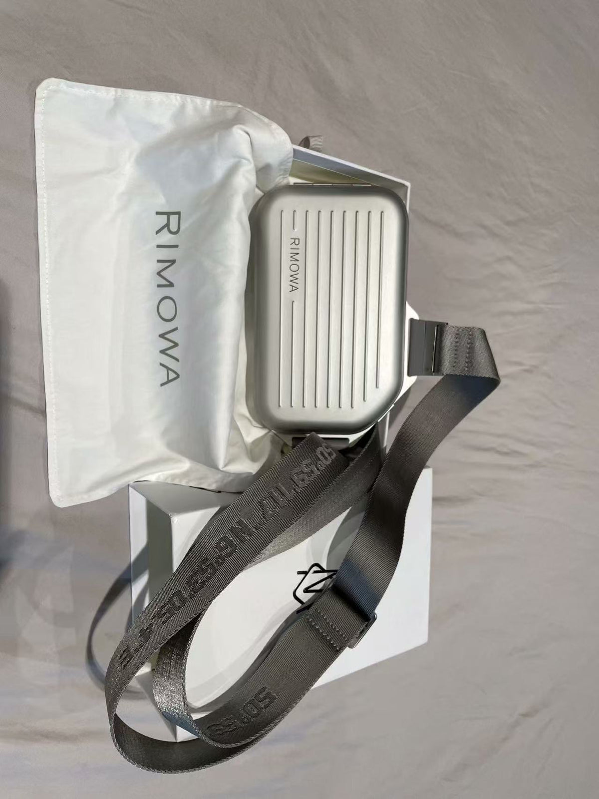 R.I.M.O.W.A Personal Sling Clutch Silver